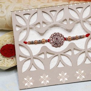 Copper Look Flower With Pearl Rakhi